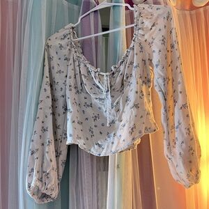 Wild fable. Size small. White long sleeve, blue flower design.